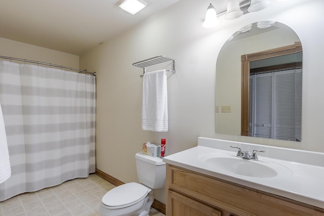 full bath featuring toilet, baseboards, and vanity
