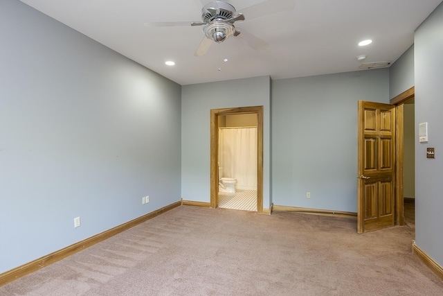 unfurnished bedroom with baseboards, ensuite bathroom, carpet, and recessed lighting