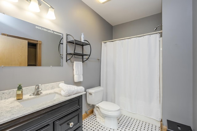 full bathroom with vanity, baseboards, toilet, and a shower with shower curtain