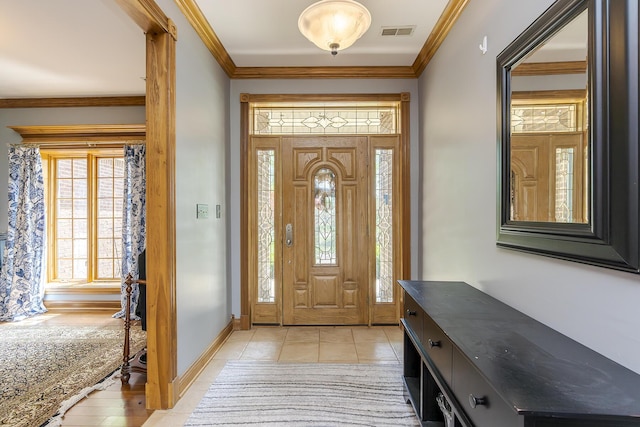 entrance foyer featuring a healthy amount of sunlight, baseboards, light tile patterned flooring, and visible vents