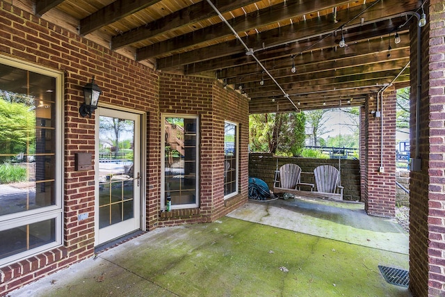 view of patio featuring fence