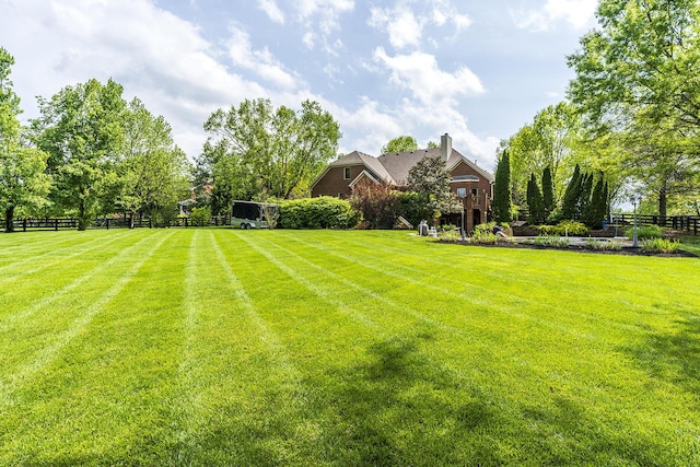 view of yard with fence