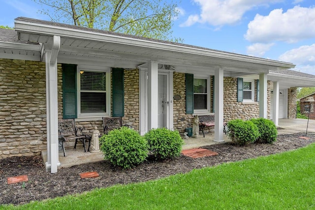 525 Hiawatha Trl, Frankfort, KY 40601 - doorway to property with stone siding, a porch, and an attached garage