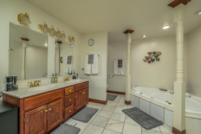 full bath with toilet, double vanity, a tub with jets, recessed lighting, and marble look tiles