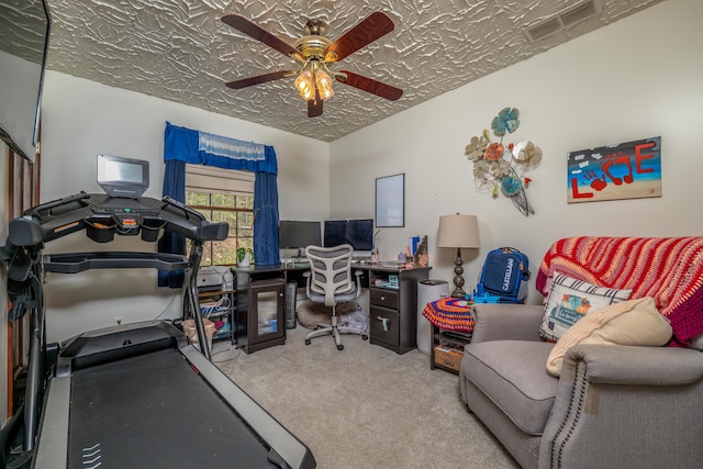 carpeted home office with ceiling fan