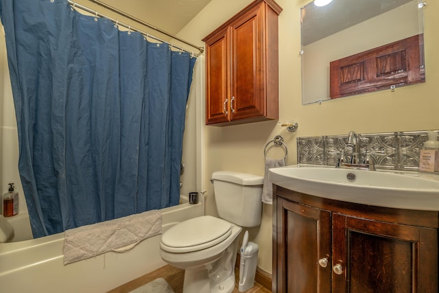 full bath featuring shower / bath combination with curtain, toilet, and vanity