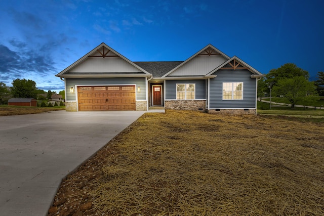 craftsman inspired home featuring a garage, a shingled roof, concrete driveway, and crawl space