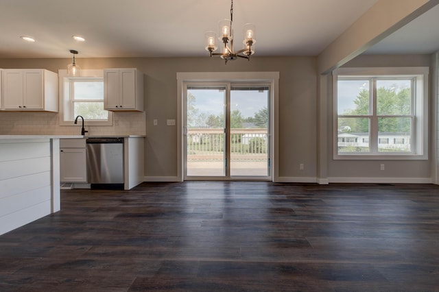 kitchen with hanging light fixtures, dishwasher, light countertops, recessed lighting, and decorative backsplash