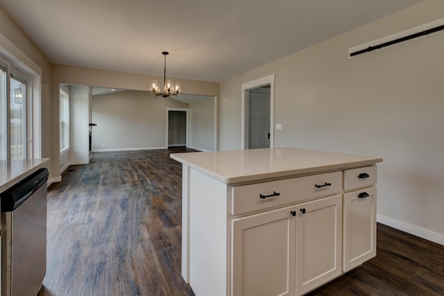 kitchen with a notable chandelier, decorative light fixtures, baseboards, stainless steel dishwasher, and dark wood-style floors