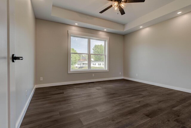138 Sande Ridge Ln, Mt Sterling, KY 40353 - unfurnished room featuring a ceiling fan, a tray ceiling, dark wood finished floors, and baseboards