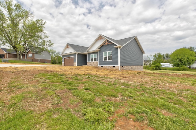 craftsman house featuring an attached garage and crawl space