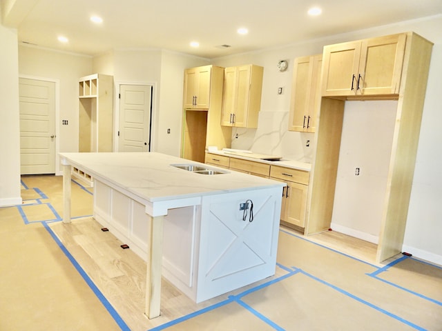 4165 Meadowlark Ln, Lexington, KY 40509 - kitchen featuring an island with sink, recessed lighting, a sink, light stone countertops, and light brown cabinetry