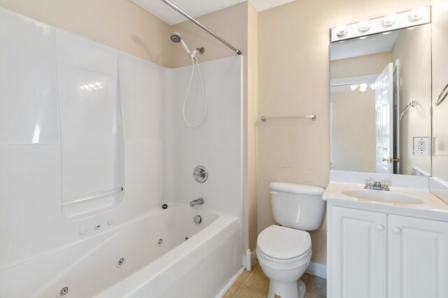 full bathroom featuring tile patterned flooring, a combined bath / shower with jetted tub, vanity, baseboards, and toilet