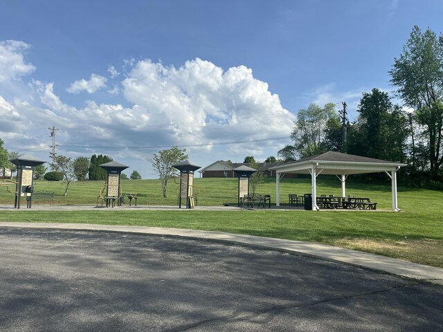 view of property's community featuring a lawn and a gazebo
