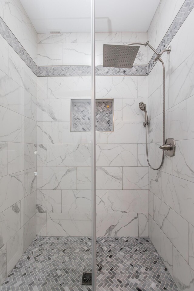 bathroom with a shower stall