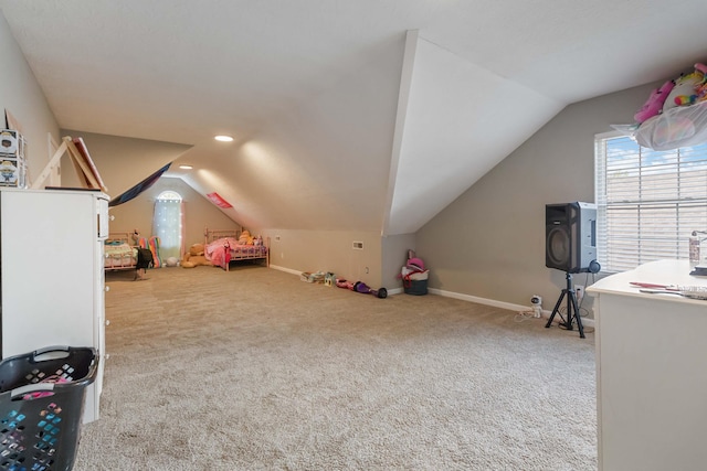 recreation room with baseboards, carpet, and vaulted ceiling