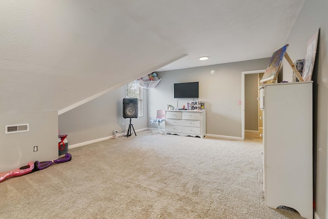 playroom featuring carpet floors, baseboards, vaulted ceiling, and visible vents