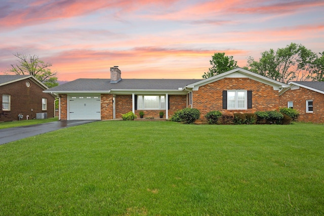 136 Pin Oak Dr, Lancaster, KY 40444 - single story home with a chimney, a yard, brick siding, and aphalt driveway