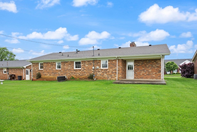 136 Pin Oak Dr, Lancaster, KY 40444 - back of property featuring a yard, a chimney, cooling unit, and brick siding