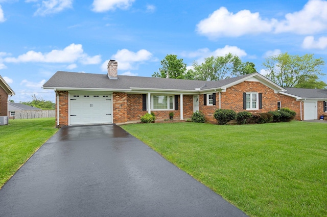 136 Pin Oak Dr, Lancaster, KY 40444 - ranch-style home with aphalt driveway, brick siding, a garage, a front yard, and a chimney