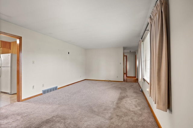136 Pin Oak Dr, Lancaster, KY 40444 - spare room featuring baseboards, visible vents, and light colored carpet