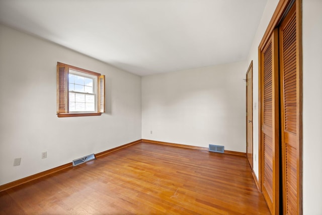 136 Pin Oak Dr, Lancaster, KY 40444 - unfurnished bedroom with a closet, baseboards, visible vents, and wood finished floors