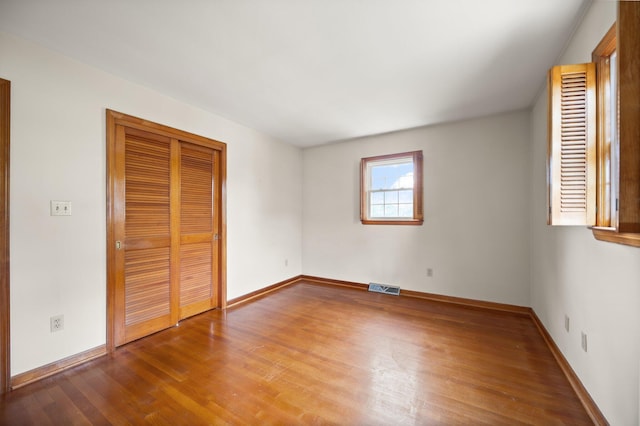 136 Pin Oak Dr, Lancaster, KY 40444 - unfurnished bedroom featuring a closet, visible vents, wood finished floors, and baseboards
