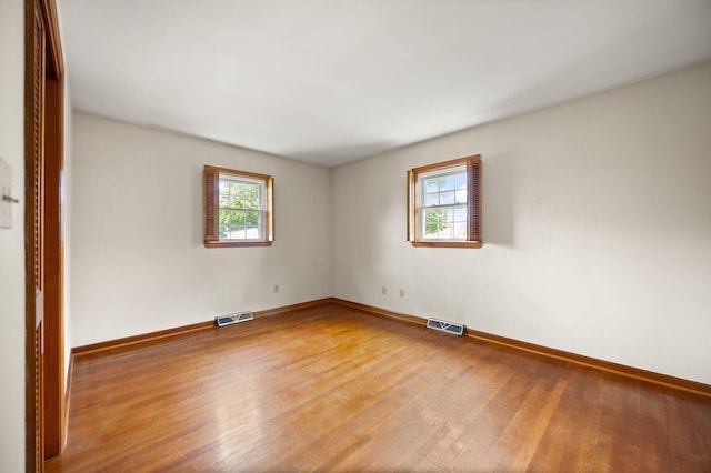 136 Pin Oak Dr, Lancaster, KY 40444 - unfurnished room featuring visible vents, wood finished floors, and a healthy amount of sunlight