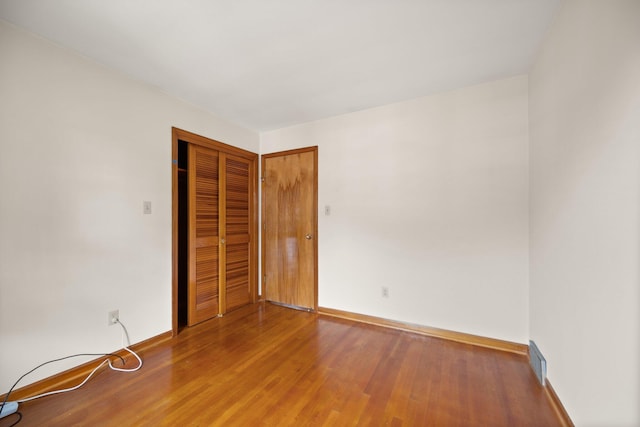 136 Pin Oak Dr, Lancaster, KY 40444 - unfurnished bedroom featuring baseboards, a closet, visible vents, and wood finished floors