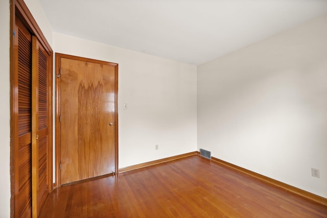 136 Pin Oak Dr, Lancaster, KY 40444 - unfurnished bedroom featuring baseboards, a closet, visible vents, and wood finished floors