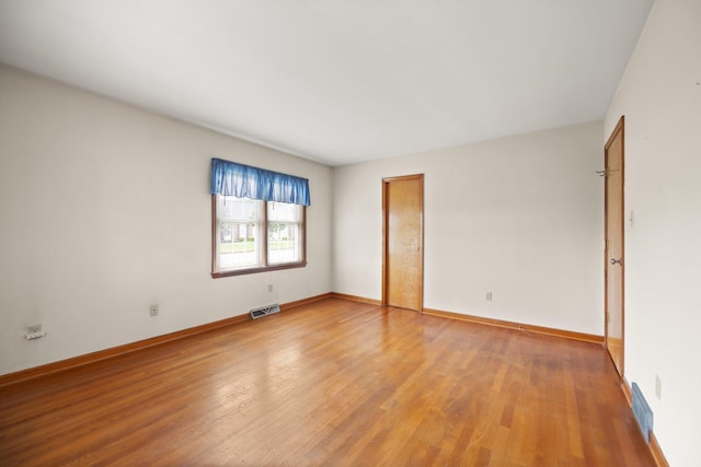 136 Pin Oak Dr, Lancaster, KY 40444 - spare room with light wood finished floors, visible vents, and baseboards