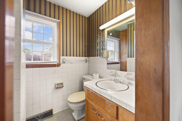 136 Pin Oak Dr, Lancaster, KY 40444 - half bathroom with wallpapered walls, toilet, tile walls, and wainscoting