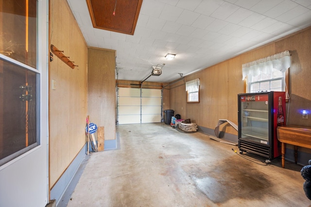 136 Pin Oak Dr, Lancaster, KY 40444 - garage with wooden walls and a garage door opener