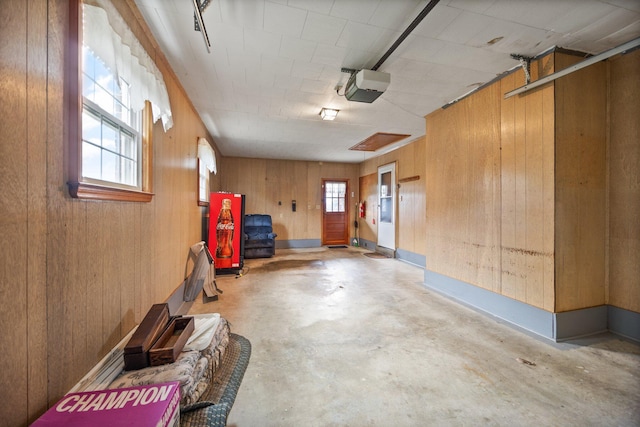 136 Pin Oak Dr, Lancaster, KY 40444 - garage with wooden walls and a garage door opener