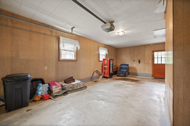 136 Pin Oak Dr, Lancaster, KY 40444 - garage featuring wooden walls and a garage door opener