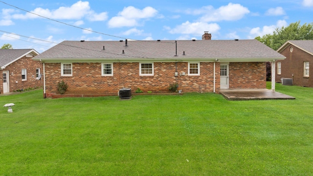 136 Pin Oak Dr, Lancaster, KY 40444 - rear view of property with a chimney, a yard, brick siding, a patio, and central AC unit