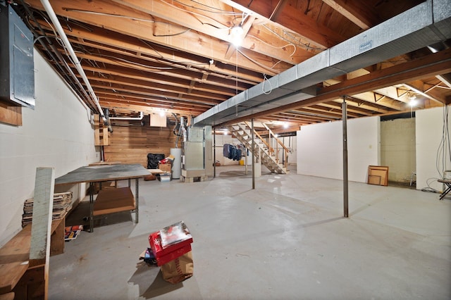 136 Pin Oak Dr, Lancaster, KY 40444 - unfinished below grade area featuring stairs, heating unit, and gas water heater
