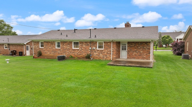 136 Pin Oak Dr, Lancaster, KY 40444 - rear view of house with brick siding, central AC, a yard, a patio, and a chimney