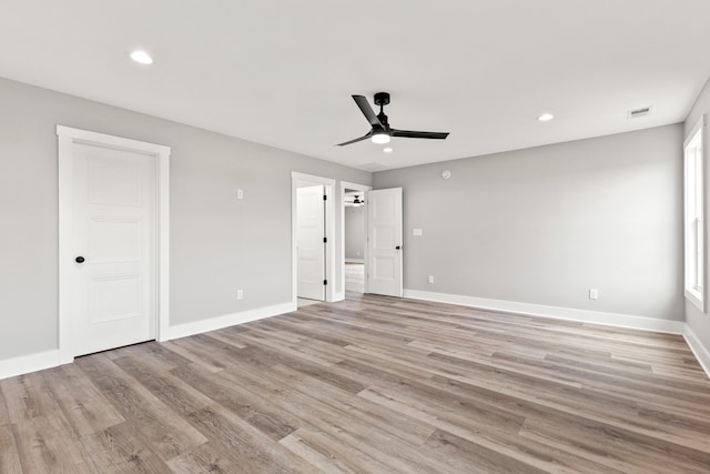 unfurnished bedroom featuring light wood-style floors, baseboards, recessed lighting, and visible vents