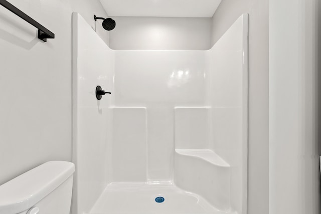 full bath with toilet and walk in shower