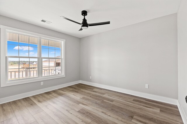 563 Middle Creek Way, Berea, KY 40403 - unfurnished room with a ceiling fan, baseboards, visible vents, and wood finished floors