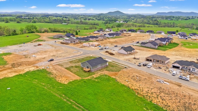 birds eye view of property featuring a mountain view and a residential view