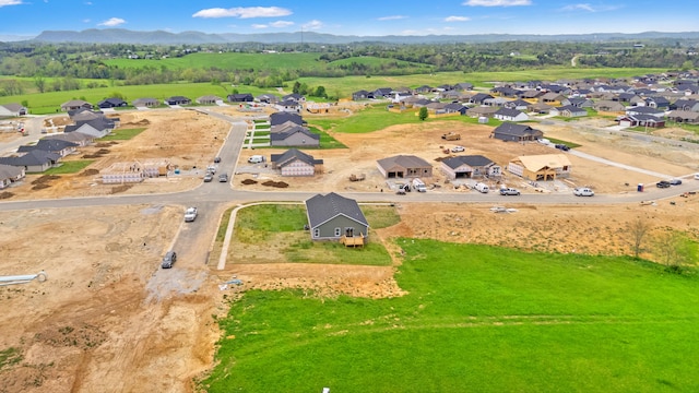 bird's eye view featuring a mountain view and a residential view
