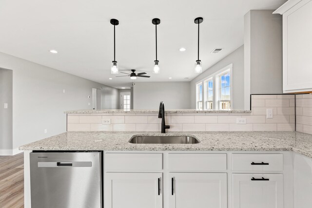 563 Middle Creek Way, Berea, KY 40403 - kitchen with stainless steel dishwasher, decorative backsplash, a ceiling fan, visible vents, and a sink