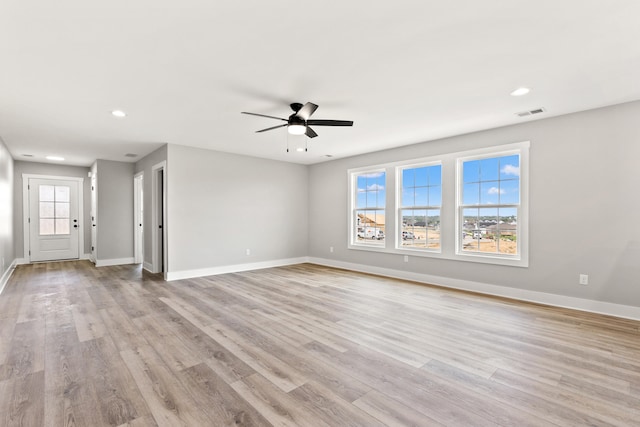 unfurnished living room with baseboards, a ceiling fan, recessed lighting, and visible vents
