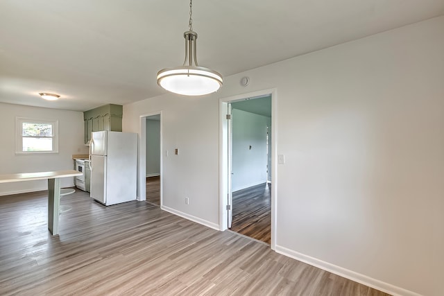 114 Cave Springs Dr, Lancaster, KY 40444 - unfurnished dining area with baseboards and wood finished floors
