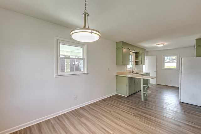 114 Cave Springs Dr, Lancaster, KY 40444 - kitchen featuring open shelves, light wood-type flooring, a sink, green cabinets, and freestanding refrigerator