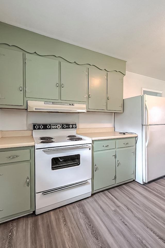114 Cave Springs Dr, Lancaster, KY 40444 - kitchen featuring light countertops, green cabinets, under cabinet range hood, white appliances, and light wood-style flooring