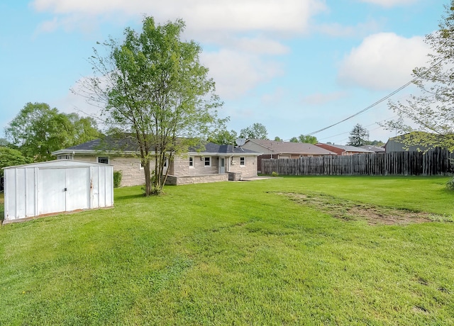 114 Cave Springs Dr, Lancaster, KY 40444 - view of yard with an outbuilding, fence, and a storage shed