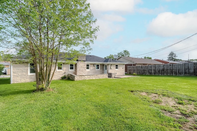 114 Cave Springs Dr, Lancaster, KY 40444 - rear view of property with a yard, stone siding, fence, and a patio area